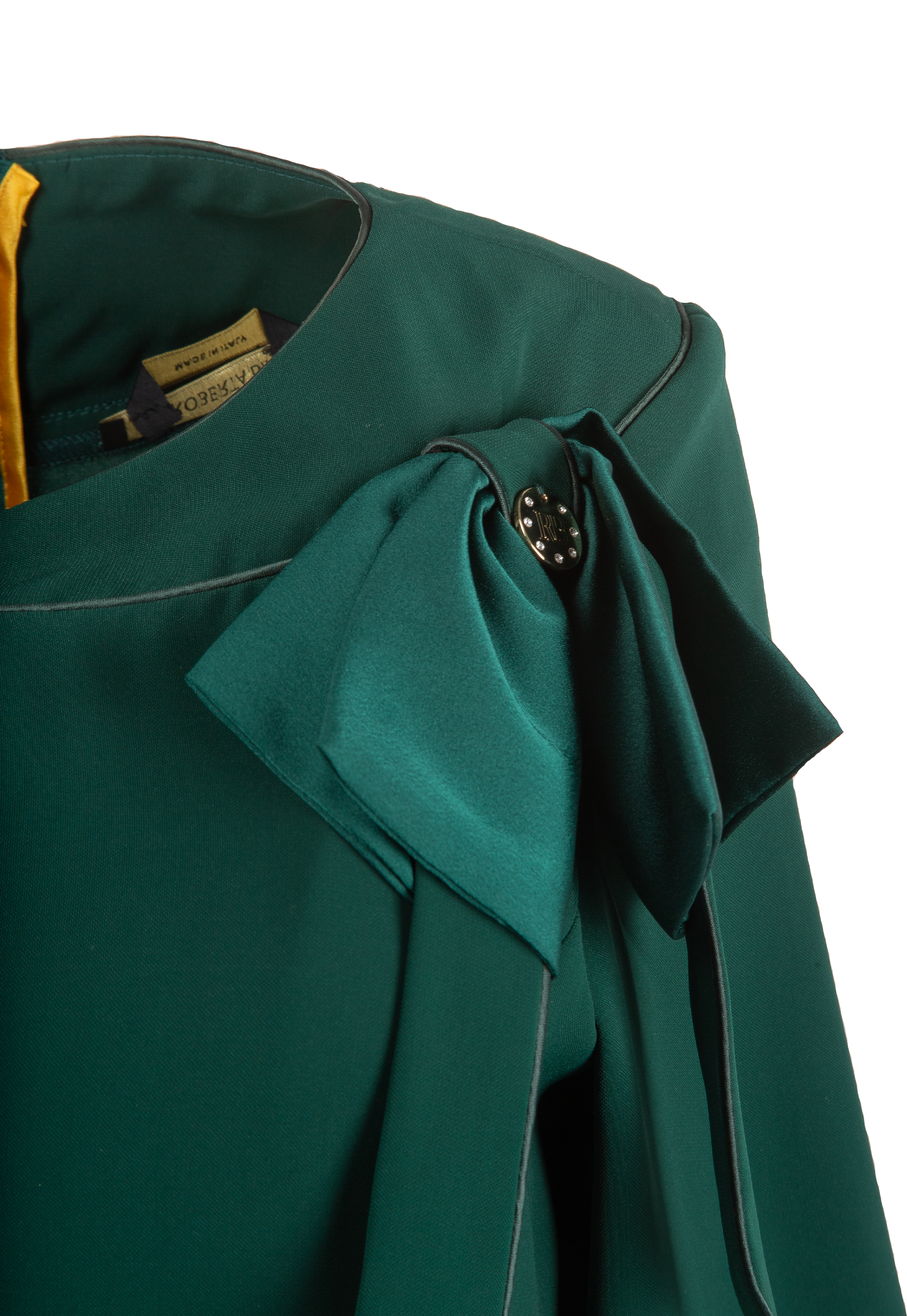 Green dress with decorative bow on the bust